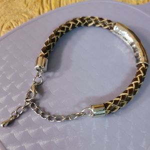 Unisex Leather and Silver Colored Metal Accent.